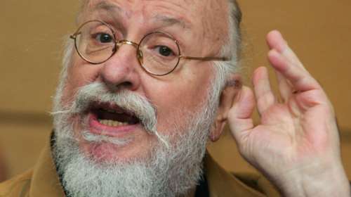 Ο Σαββόπουλος τραγουδά κάλαντα μπροστά από τα καμμένα Απόλλων Αττικόν