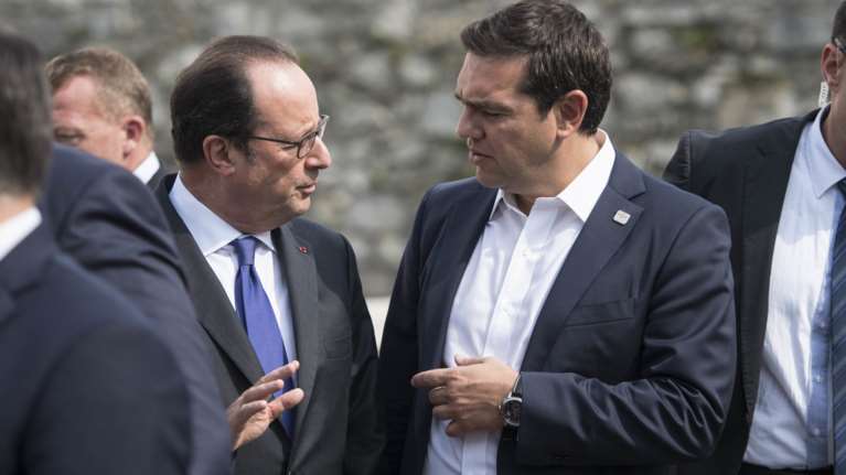 Συνάντηση Τσίπρα - Ολάντ στο Αμπού Ντάμπι πριν το Eurogroup