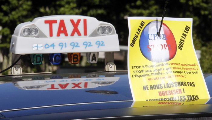 «Κόλαση» στη Γαλλία μεταξύ οδηγών ταξί και Uber - εικόνα 2
